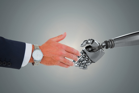 Businessman in suit clenching fists against blue vignette backgroundの写真素材