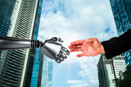 Hand presenting against cityの写真素材