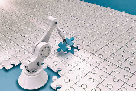 High angle view of robot setting up jigsaw puzzles 3dの写真素材