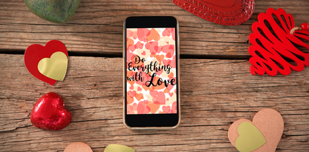 Web against smartphone and heart decorationsの写真素材