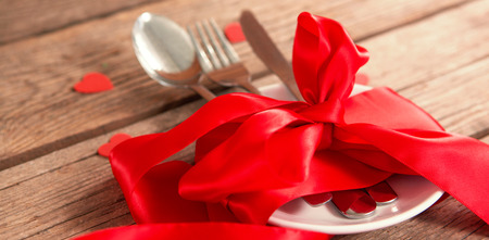 Plate surrounded by a red ribbonの写真素材