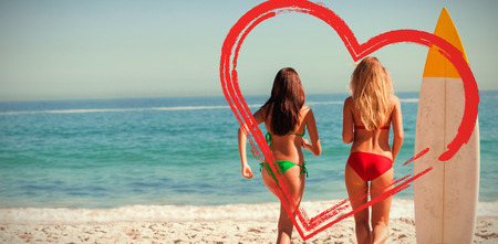 rear view of friends running to seaの写真素材