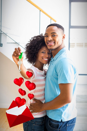 Love letter against happy couple embracing in their new home 3dの写真素材