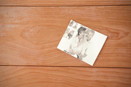 envelope red heart against old man tasting vegetable held by wifeの写真素材
