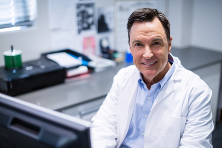 Portrait of male doctor smiling in clinicの写真素材