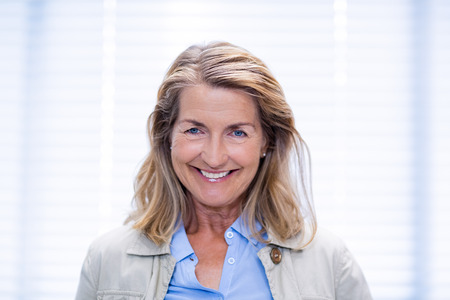 Portrait of smiling female patient in clinic