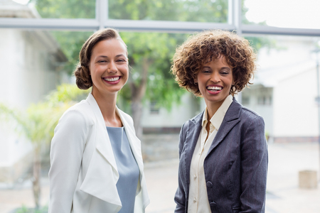 Portrait of cheerful business executives at conference centreの写真素材