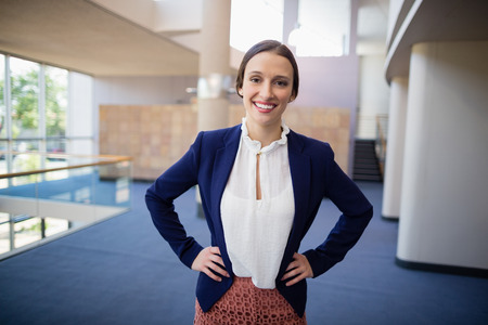 Portrait of a happy businesswoman with arms crossedの写真素材