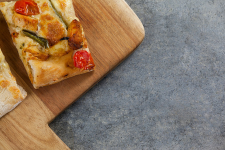 Close-up of delicious italian pizza served on grey background