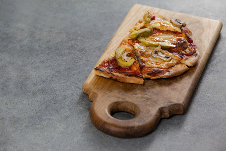 Close-up of delicious italian pizza served on grey backgroundの写真素材