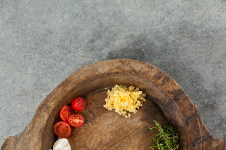 Close-up of spices and vegetable in wooden bowlの写真素材