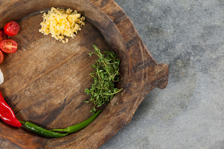 Close-up of spices and vegetable in wooden bowlの写真素材