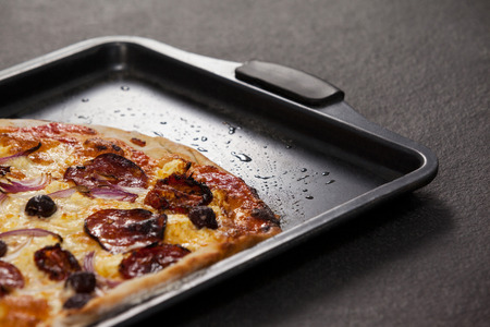 Close-up of delicious italian pizza served on trayの写真素材