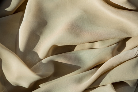 Close-up of beige fabric in the studio