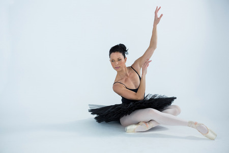 Ballerina practicing ballet dance in the studioの写真素材