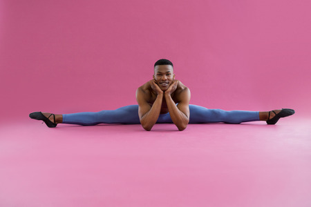 Portrait of ballerino performing a split in the ballet studioの写真素材