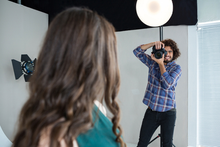 Female model posing for a photoshoot in the studioの写真素材
