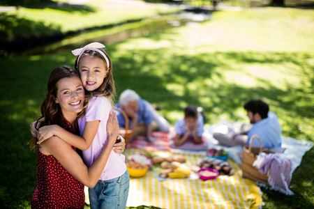 Happy family enjoying in park on sunny a dayの写真素材