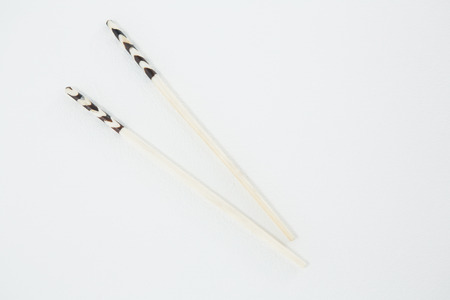 Close-up of japanese style chopsticks on white backgroundの写真素材