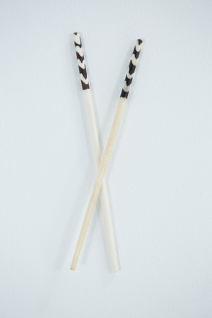 Close-up of japanese style chopsticks on white backgroundの写真素材