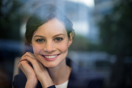 Portrait of young businesswoman smiling in cafÃ©の写真素材