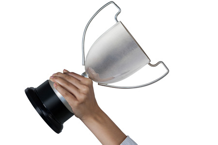 Females hands holding trophy against white backgroundの写真素材