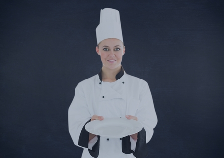 Digital composite of Chef with plate against navy backgroundの写真素材