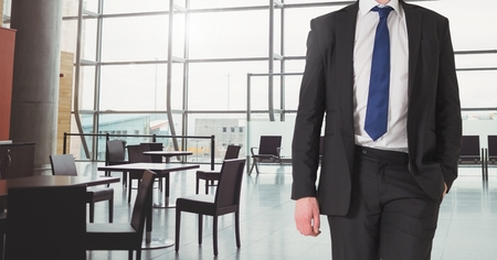 Digital composite of Businessman Torso against a reception area backgroundの写真素材