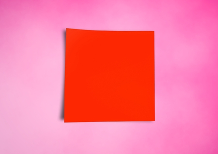 Digital composite of red Sticky Note against pink backgroundの写真素材