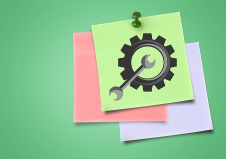 Digital composite of colored Sticky Note Settings Cog icon against green backgrounの写真素材
