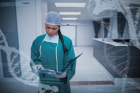 Panoramic view of helix pattern information on device screen against surgeon checking report in corridorの写真素材