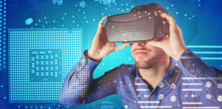 Man using an oculus against micro parts in computer chip
