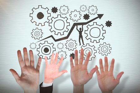 Businessman in suit with hand raised against vignetteの写真素材