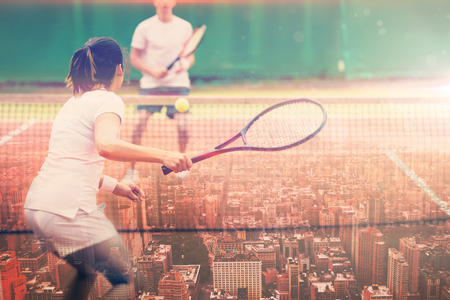 New York against tennis players playing a match on the courtの写真素材