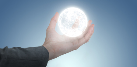 Businesswoman hand gesturing against against grey vignetteの写真素材