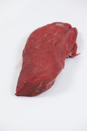 Close-up of beef steak against white backgroundの写真素材