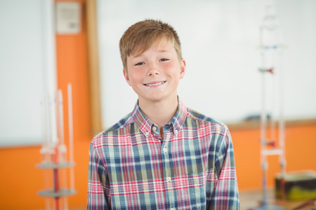 Portrait of smiling schoolboy in school
