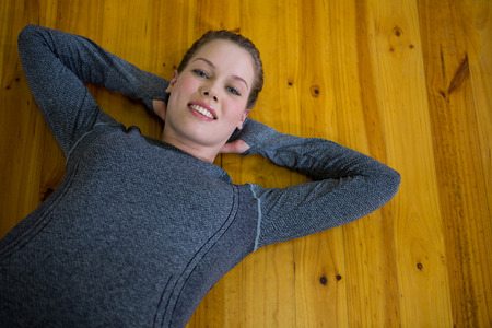 Portrait of beautiful woman exercising in gymの写真素材