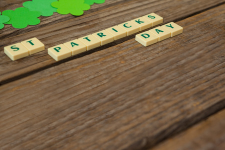 St Patricks Day blocks with shamrocks on wooden tableの写真素材
