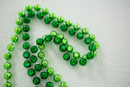 St Patricks Day close-up of beads on white backgroundの写真素材
