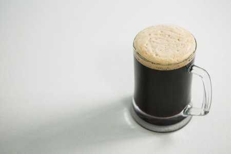 Close-up of black beer on white backgroundの写真素材