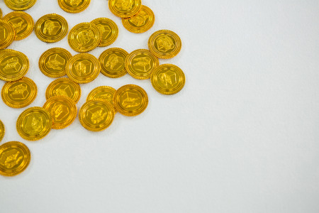 St. Patricks Day chocolate gold coins on white backgroundの写真素材