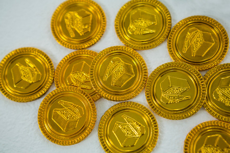 St. Patricks Day chocolate gold coins on white backgroundの写真素材