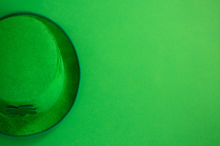 St Patricks Day leprechaun hat with shamrock on green background