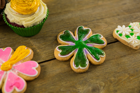 St Patricks Day cupcake and cookies on wooden tableの写真素材