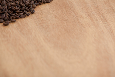 Roasted coffee beans on wooden table