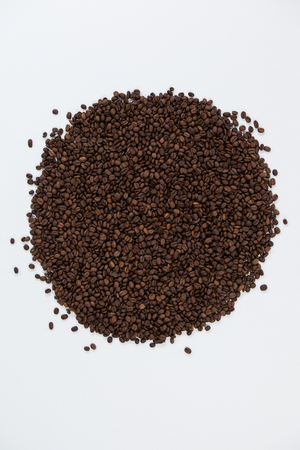 Roasted coffee beans on white backgroundの写真素材