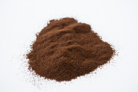 Pile of coffee powder on white background