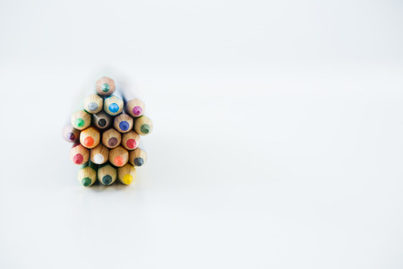 Close-up of bunch of colored pencil on white background