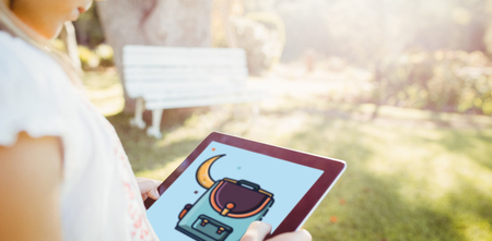 Print against kid using technology during a sunny dayの写真素材
